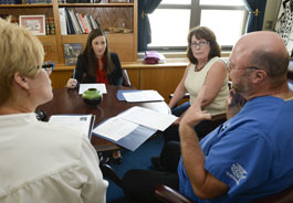 Veterinarians and a constituent meet with the legislative director for Mass. State Senator Dan Wolf
