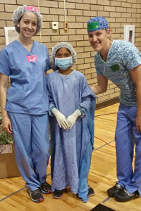 HSVMA-RAVS volunteers Cyndi Davidson (l) and Kara Miller (r) with inspiring San Carlos Apache tribe member and future veterinarian, Erin